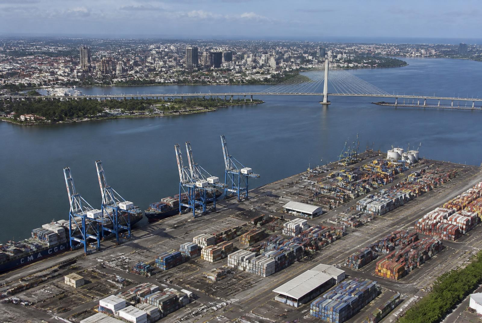Aerial view of the Port of Abidjan with the Henri Konan Bédié bridge and the Plateau skyline, Côte d'Ivoire